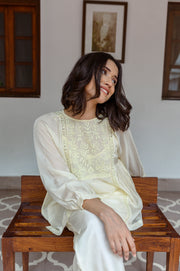 Top with hand embroidered yoke along with spaghetti lining
