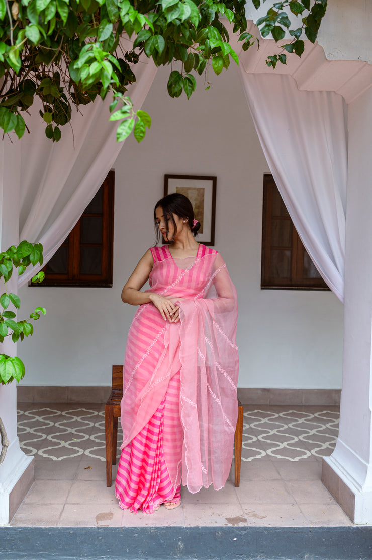Striper pleates with silk organza hand embroidered pallu and scalloped edges.